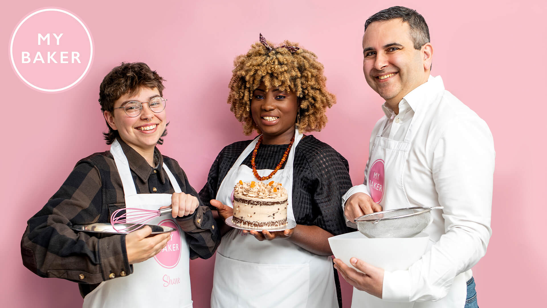 The My Baker team infront of a pink backdrop