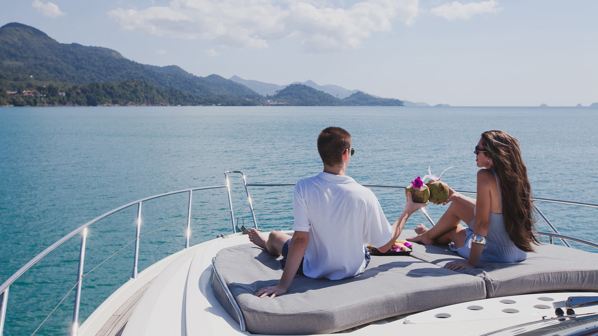 Couple sitting on the deck of a private yacht