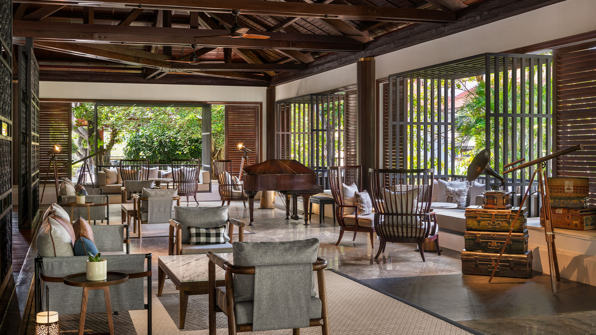 A lobby sitting area at The Laguna Resort with lots of luxury chairs and tables