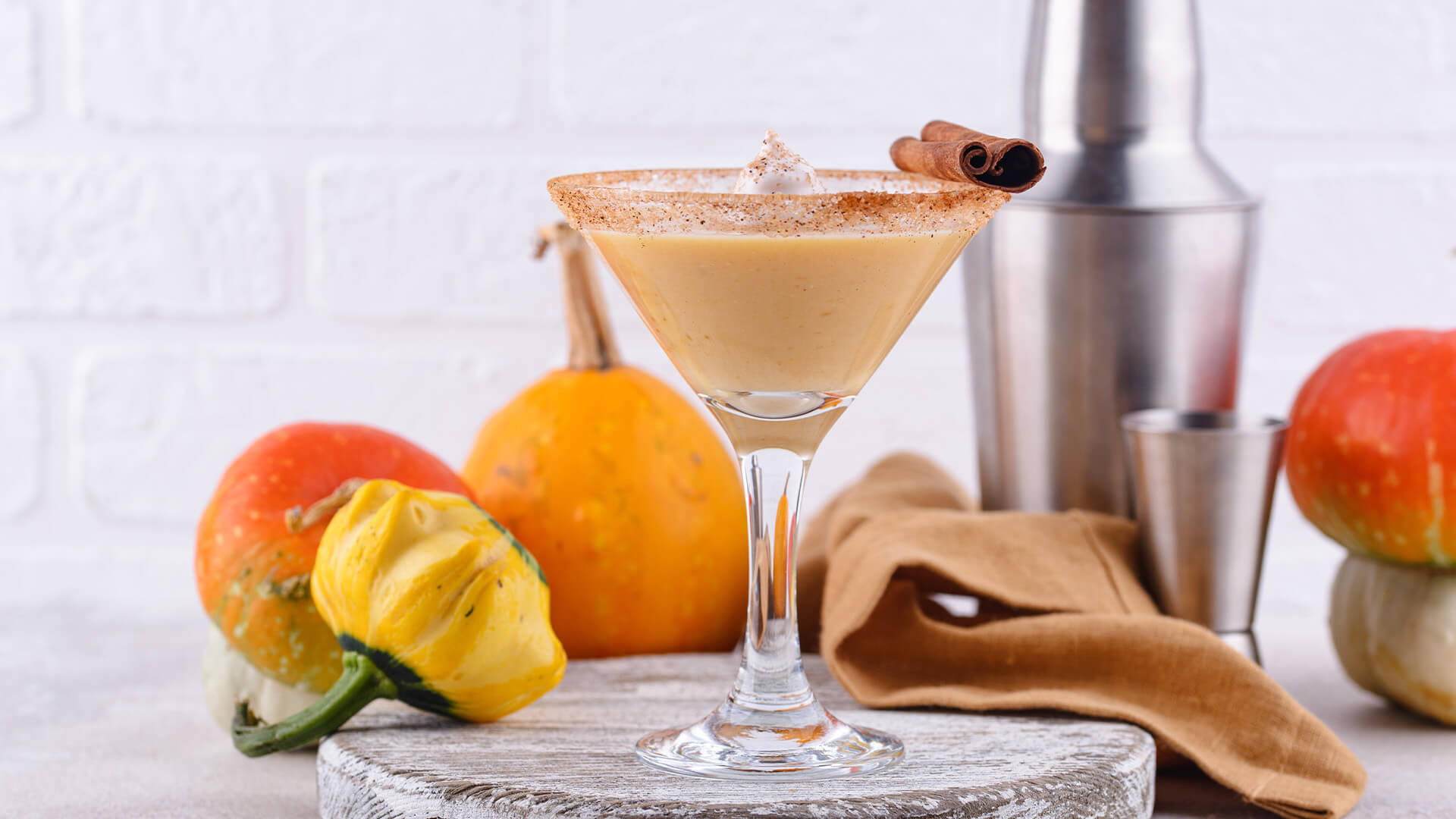 Pumpkin Martini on kitchen table with pumpkins next to it