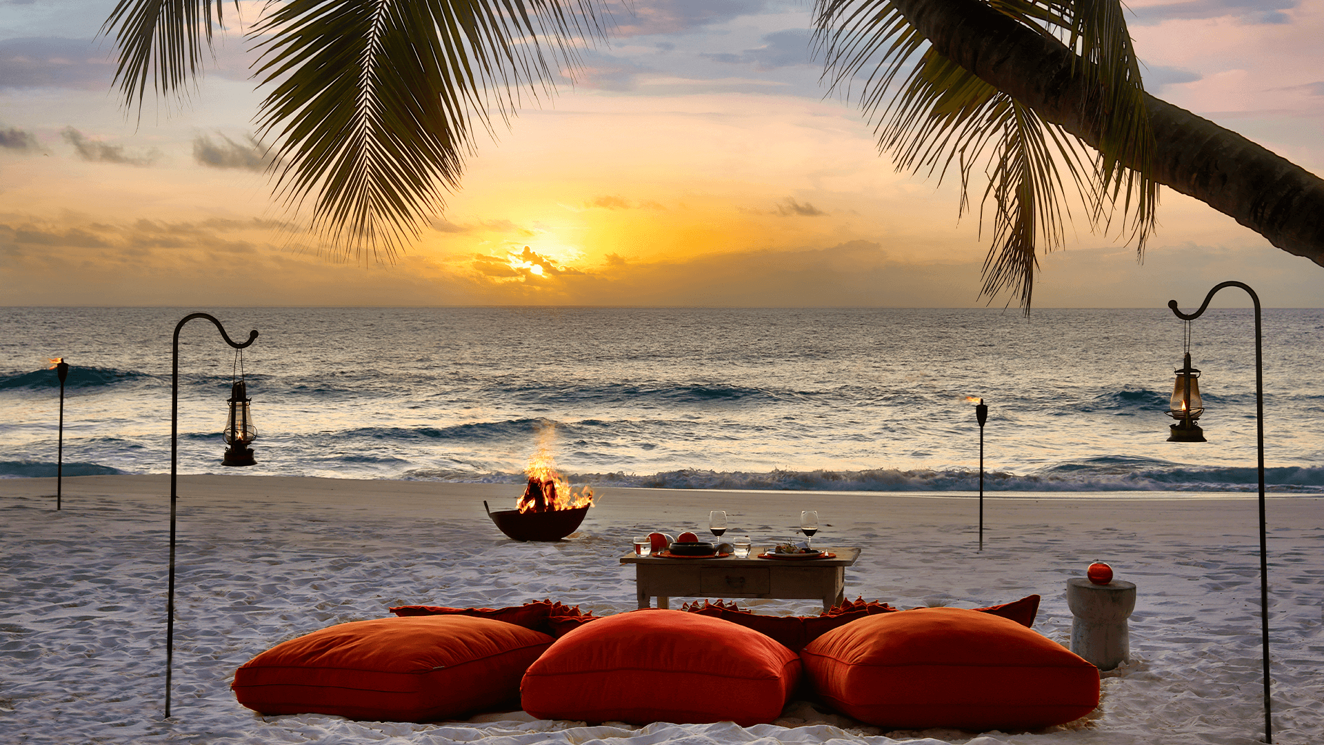 Picnic on a beach at sunset