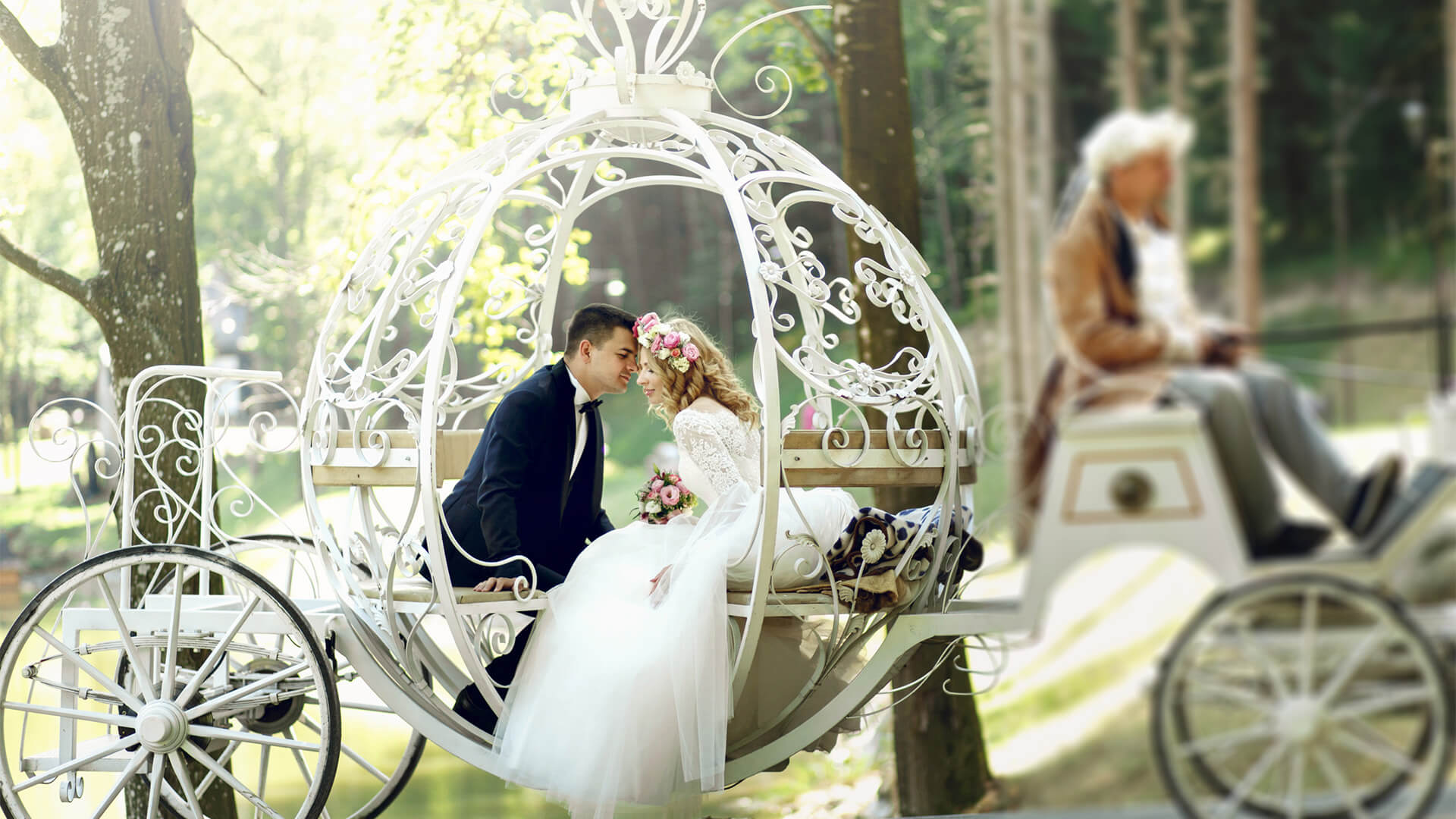 bride and groom sitting in a fairytale looking carriage