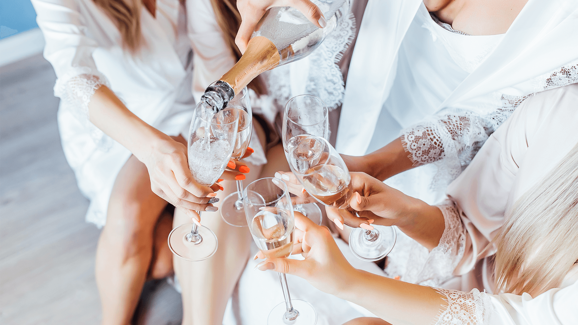 Close up photo of womans drink champagne. Hen party.