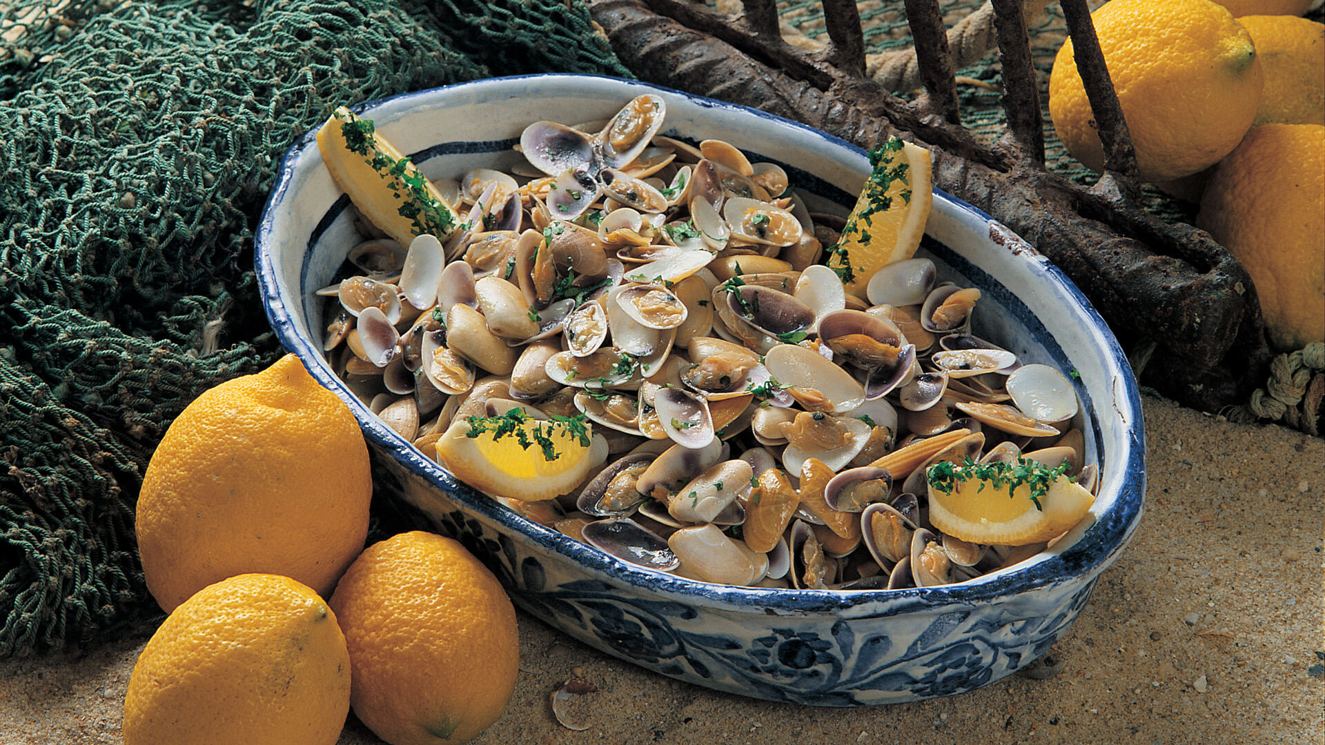 Oysters in bowl with lemons