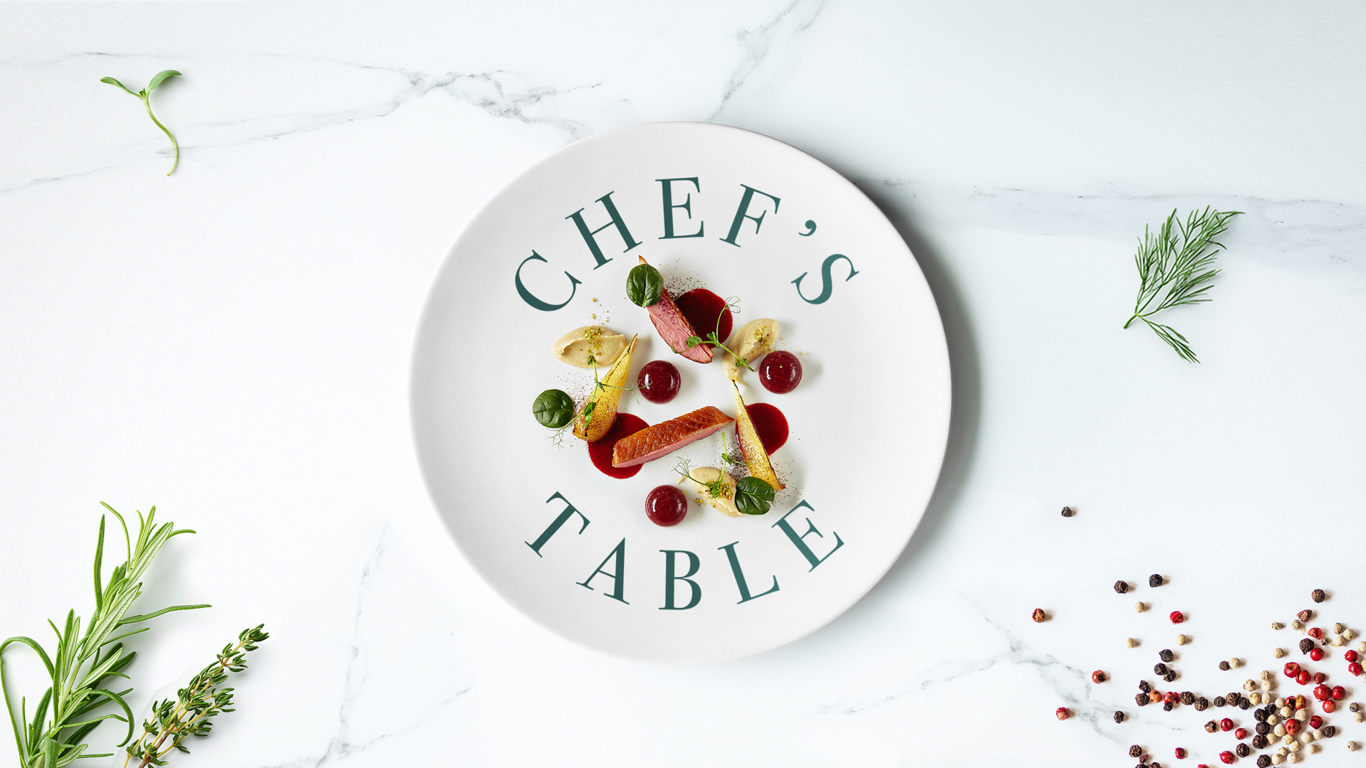a plate with food and the text chefs table
